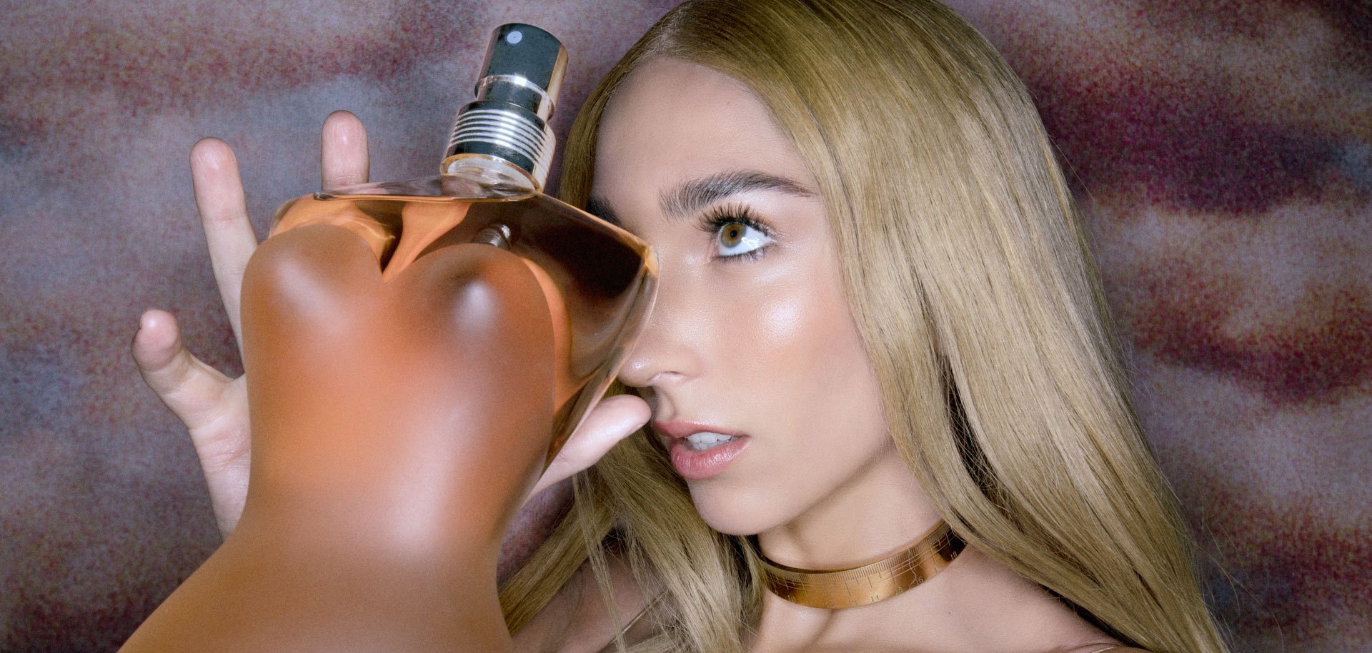 The muse hiding behind the Classique eau de toilette fragrance bottle